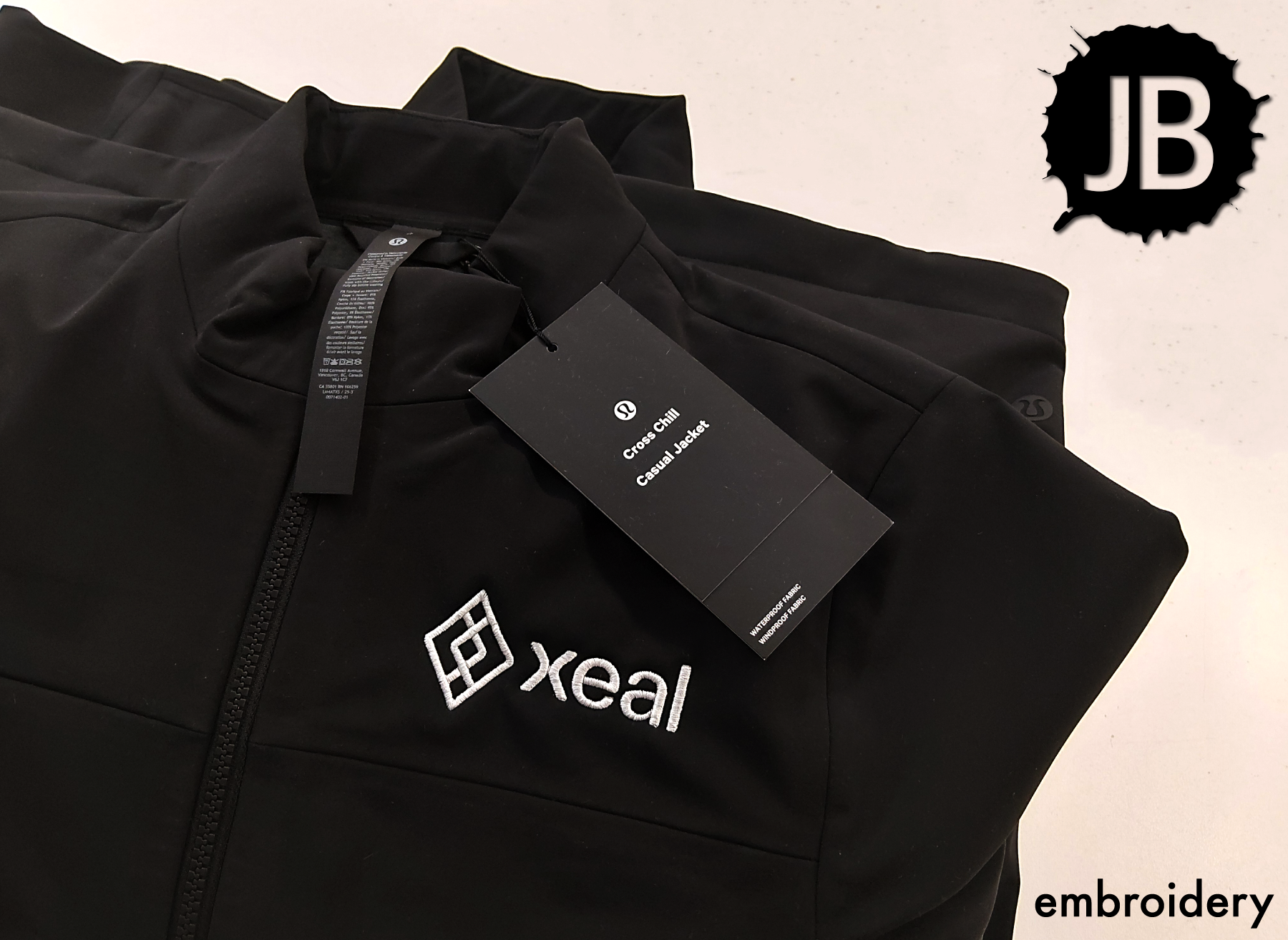 XEAL embroidery on customer-provided lululemon jacket